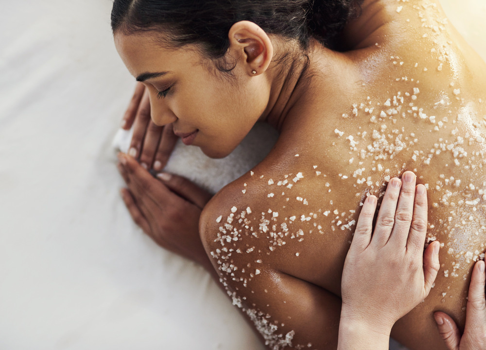 Shot of a young woman getting an exfoliating massage at a spa.